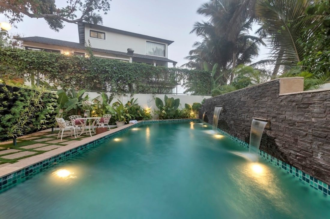 Poolside planting at Casa Del Sogno Villa, Anjuna, lit at dusk