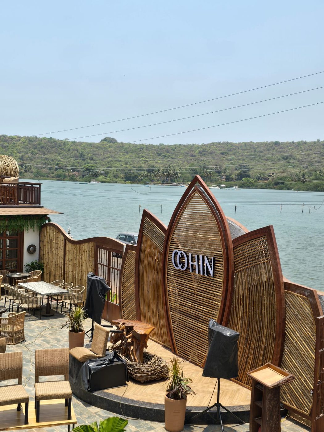 Bamboo signage and waterfront setting at Cohin, Goa